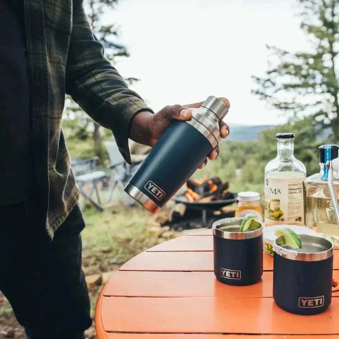 Yeti cocktail shaker in Navy and two Yeti Navy mugs